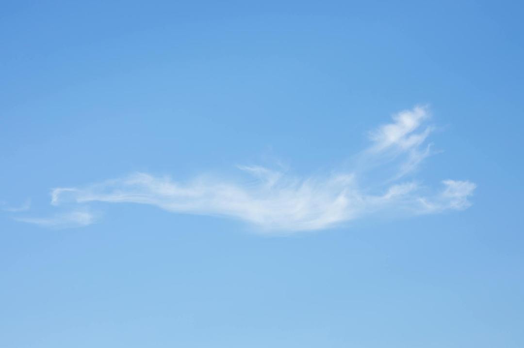 blue sky with a dash of white clouds